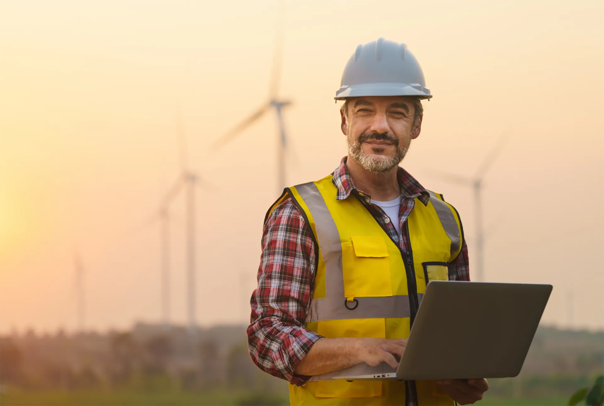 renewable energy worker reviewing HSE documents on the field