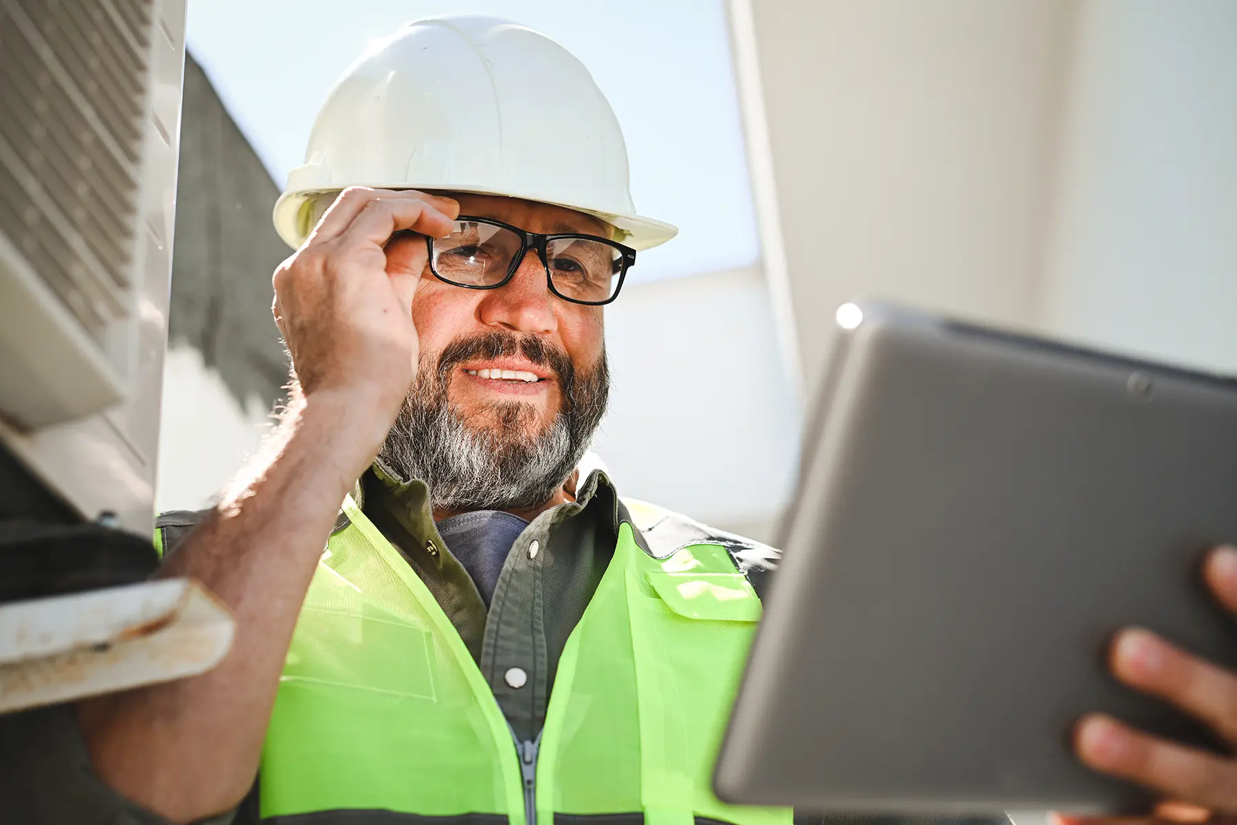 Engineer on the field reviewing HSE documents