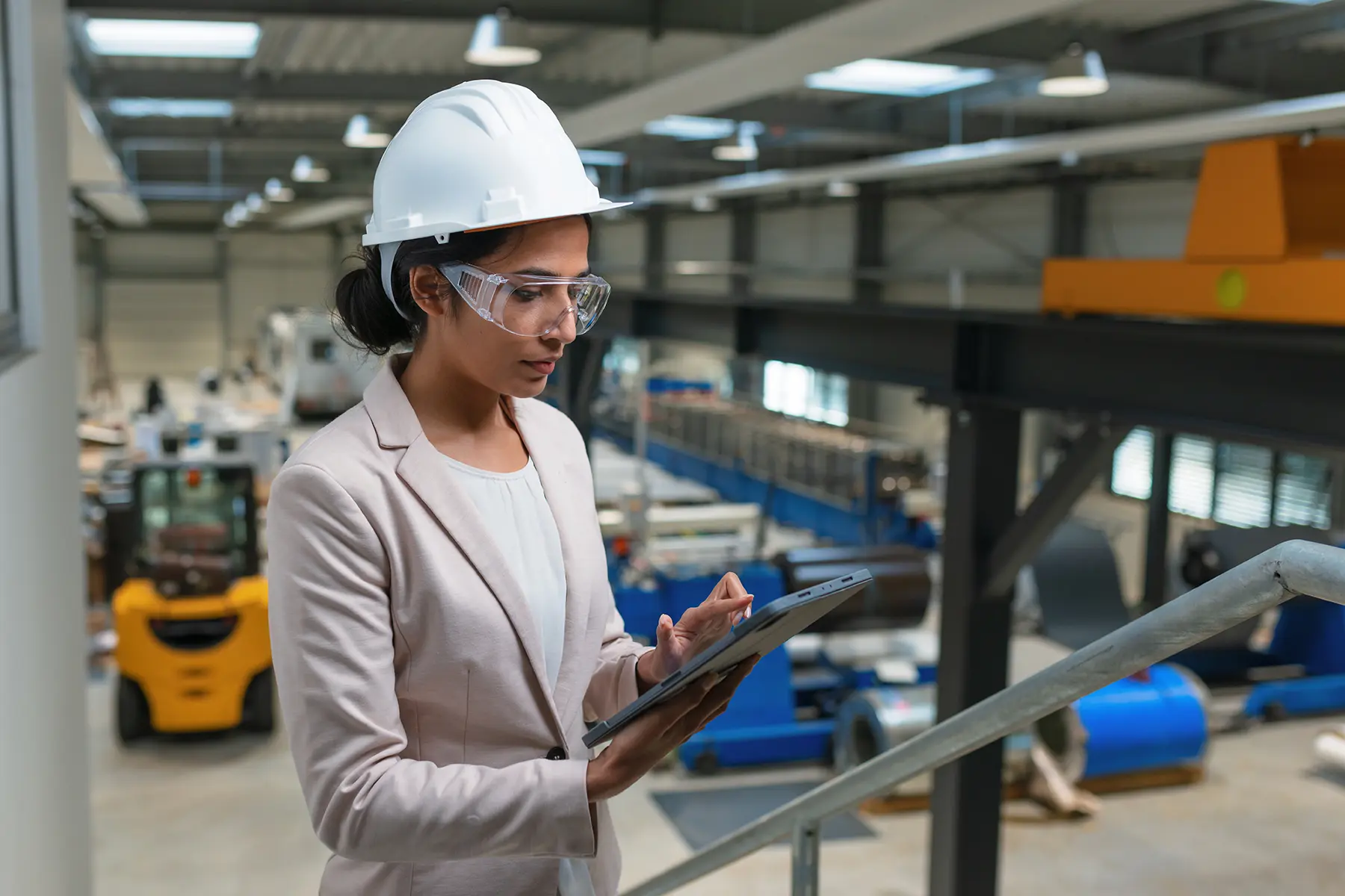 female HSE manager reviewing HSE documents